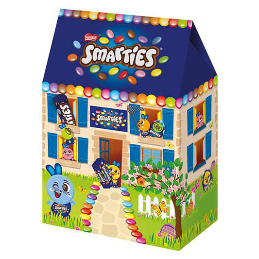 Smarties candy house-shaped packaging with colorful Smarties on a white background