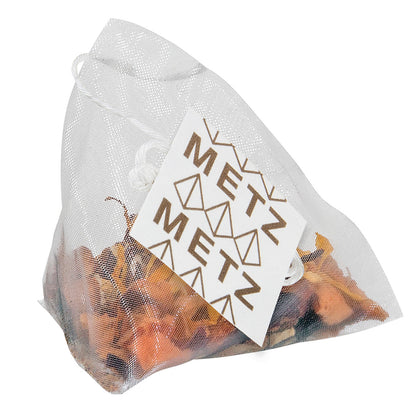 Clear drawstring bag with dried herbs and a 'METZ' label on a white background