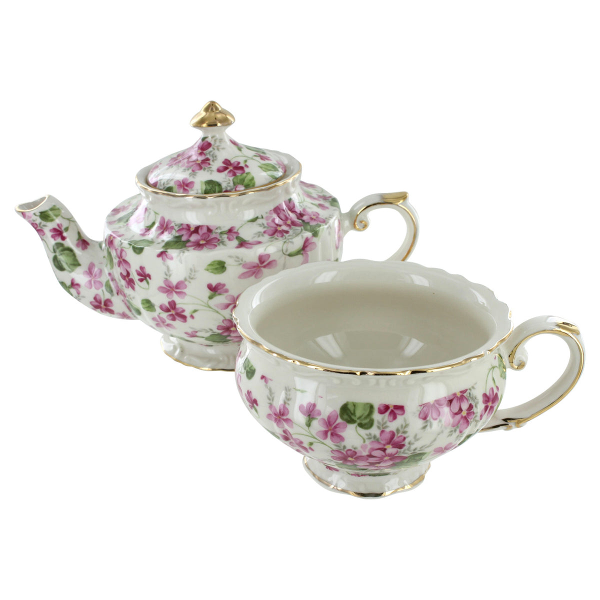 Porcelain teapot and teacup set with floral design on a white background