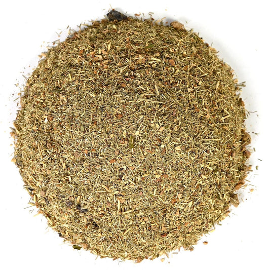 Round pile of green and white tea leaves on a white background