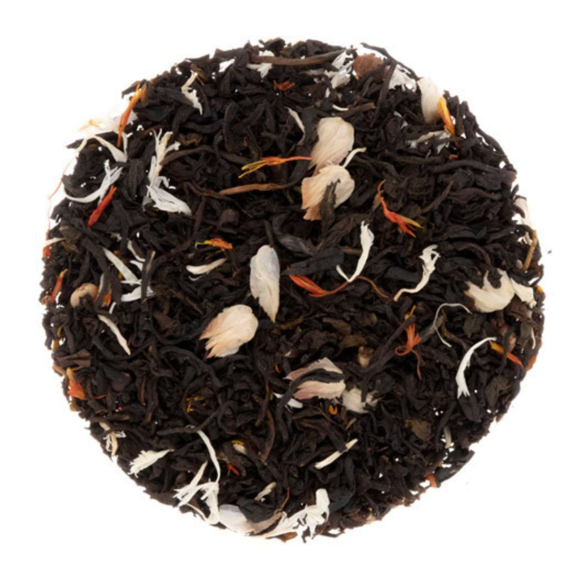 Black tea leaves with visible flowers and herbs on a white background