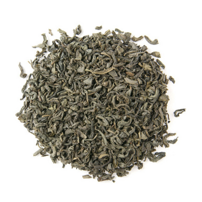 Dry green tea leaves on a white background