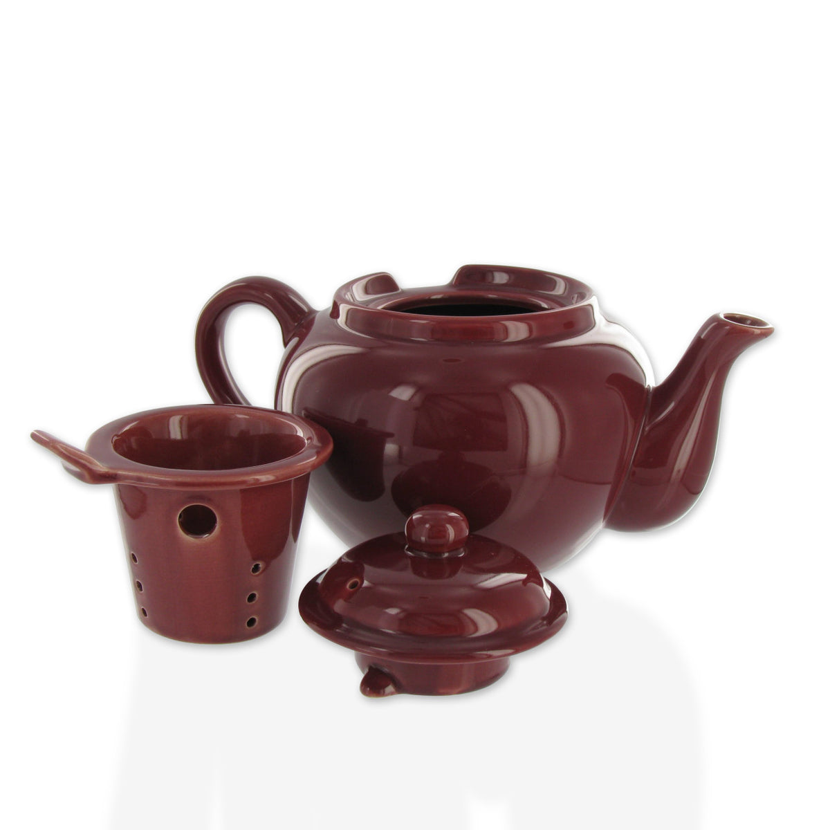 Burgundy ceramic teapot set with a lid and cup on a white background