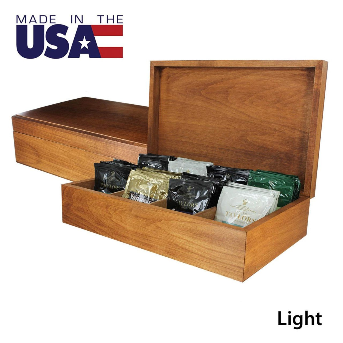 Wooden box with compartments containing tea bags, labeled 'Made in the USA' and Light