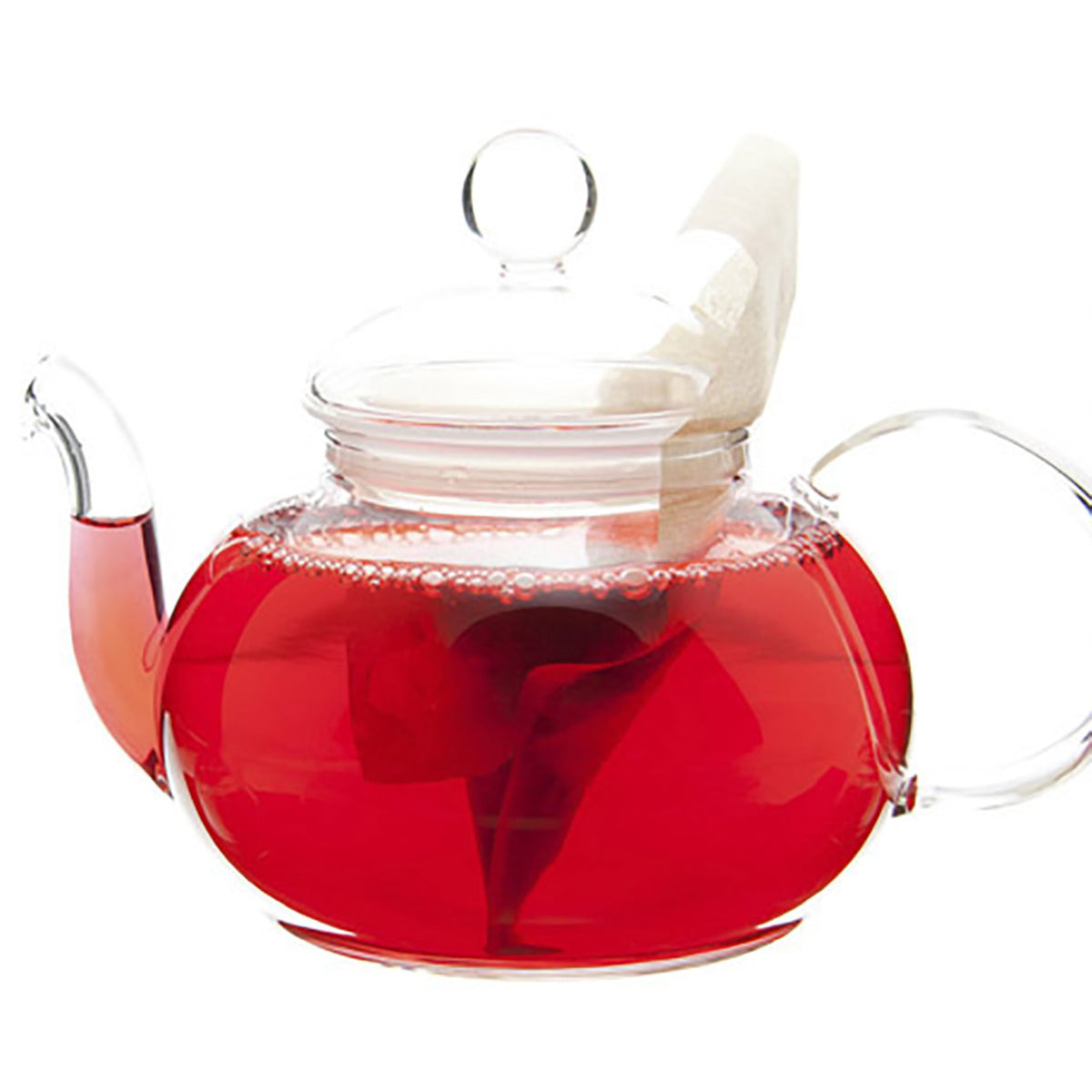 Clear glass teapot with red hot tea and a white tea bag on a white background