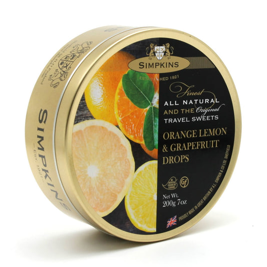 Simpkins orange lemon & grapefruit drops tin on a white background