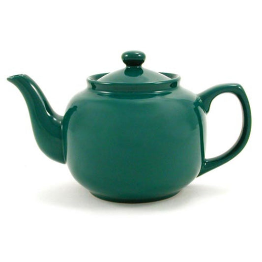 Green teapot on a white background