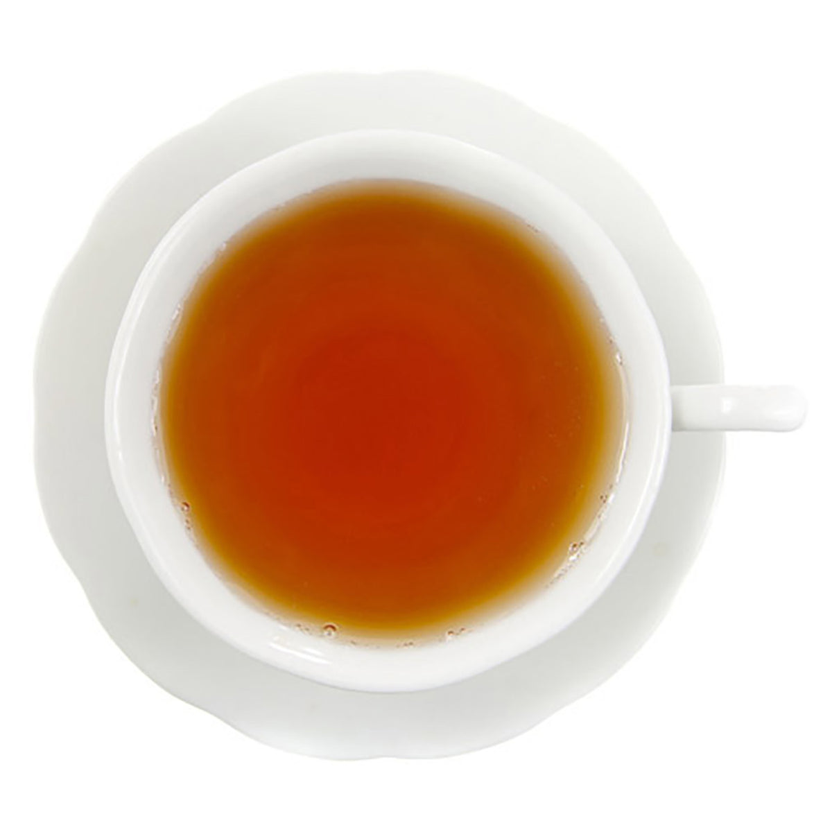 White cup and saucer with a warm beverage on a white background