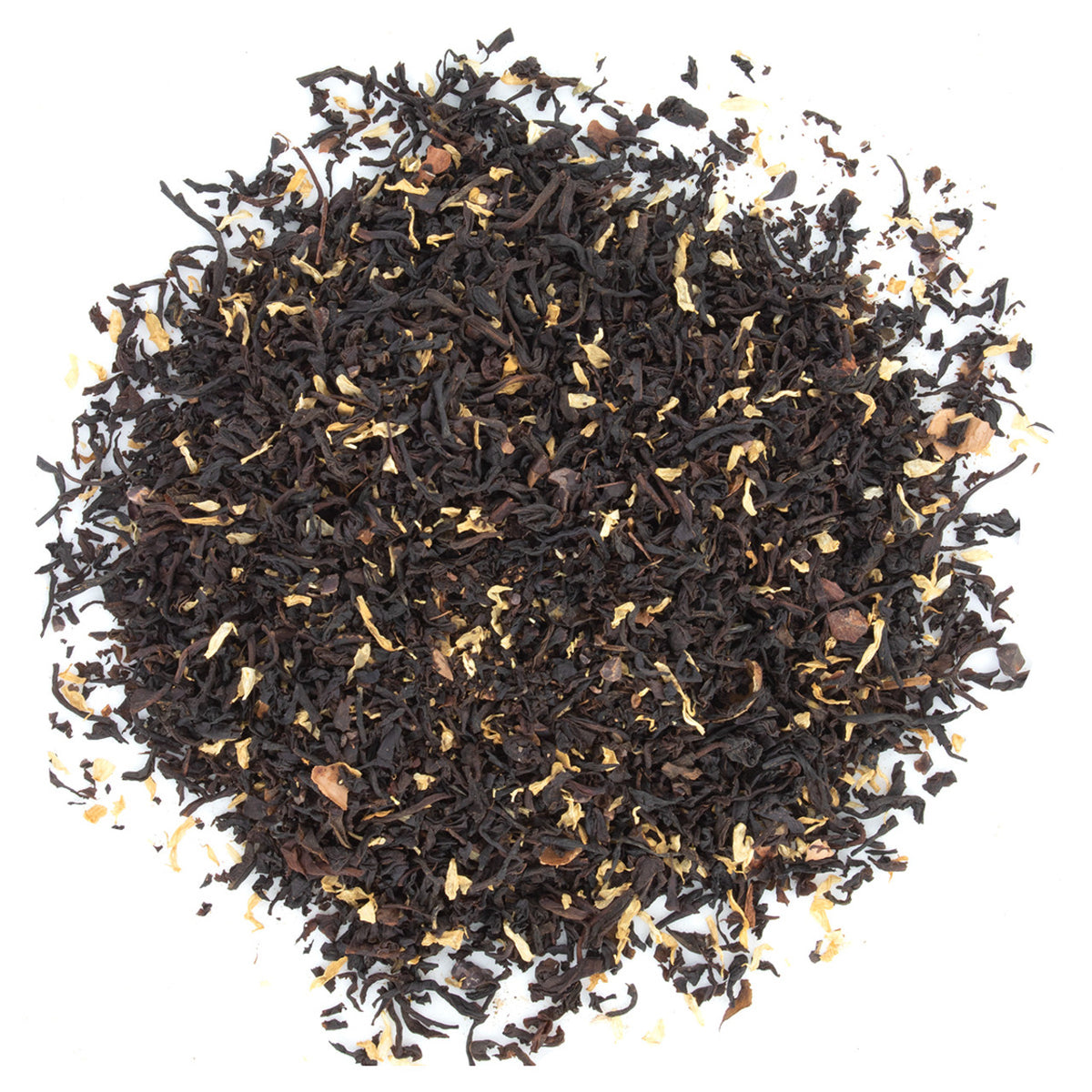 A close-up of flavored black tea loose leaf, showing the mix of black tea leaves, cocoa pieces, and camomile petals.