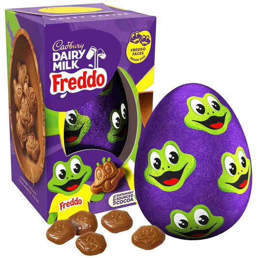 Purple chocolate egg with green frog faces and Cadbury Dairy Milk Freddo packaging.