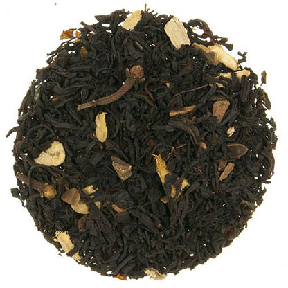 Close-up of black tea leaves with beige colored leaf pieces on a white background