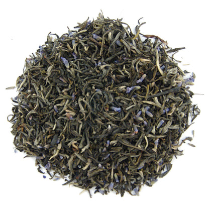 Dry tea leaves on a white background