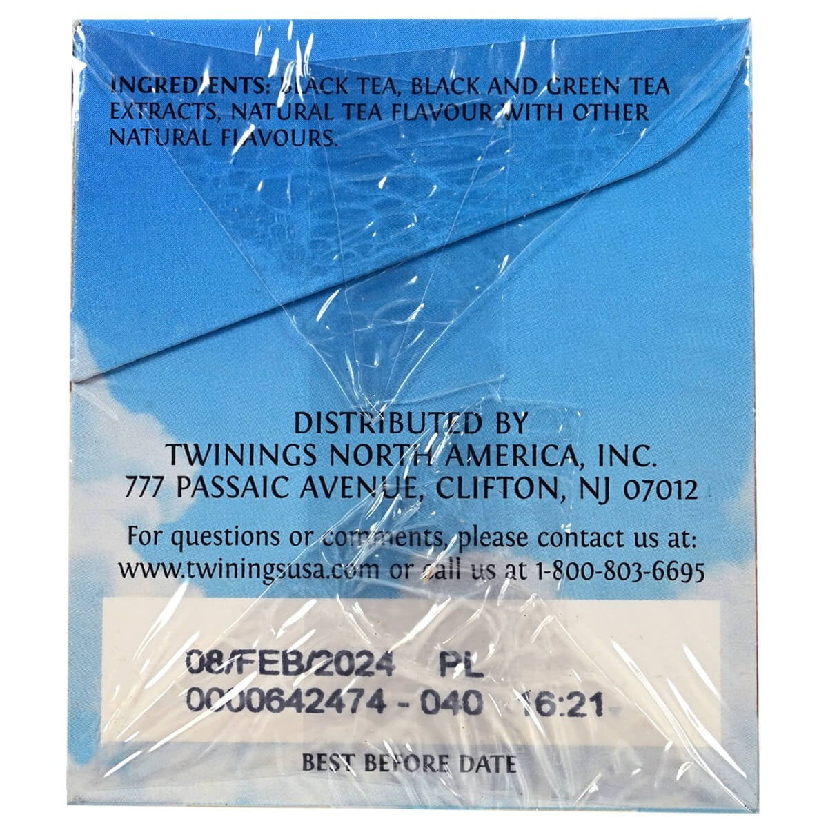Tea package with blue background and white text displaying distribution details and best before date.