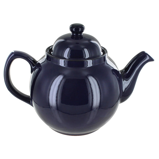Navy blue teapot on a white background