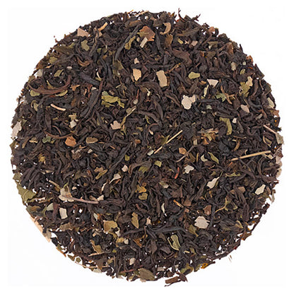 Round pattern of Chocolate Mint Black Tea leaves on a white background