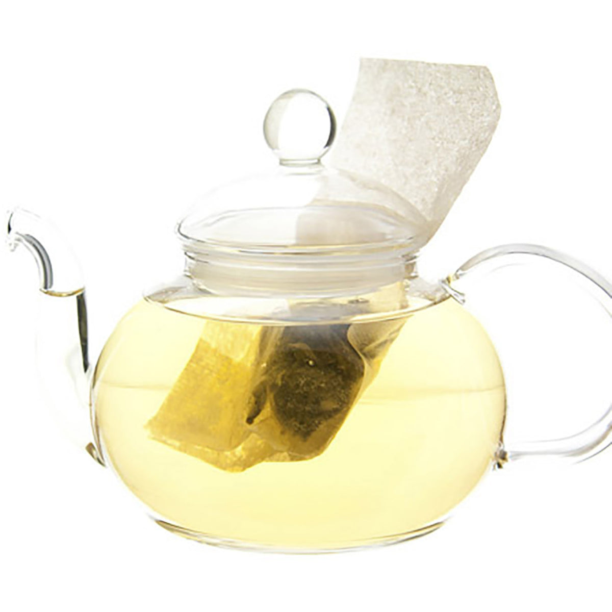 Glass teapot on a white background with a teabag inside and hot yellow colored tea
