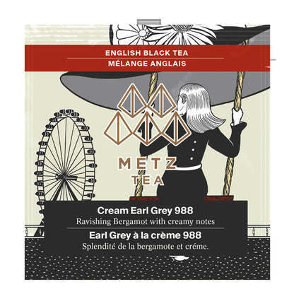 Tea package with illustration of a woman and Ferris wheel, featuring Metz Tea branding.