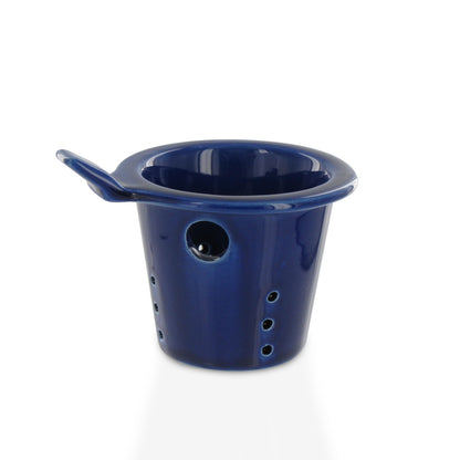 Blue ceramic teapot infuser with a handle on a white background