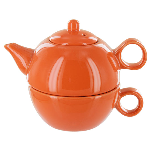 Orange teapot with a matching cup on a white background