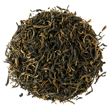 A close-up image of loose leaf black tea with a focus on the texture and appearance of the leaves.
