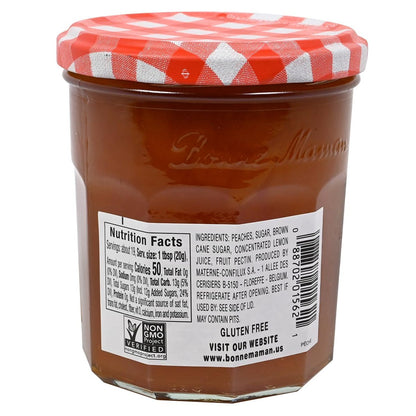 Jar of Bonne Maman peach jam with a red and white checkered lid on a white background