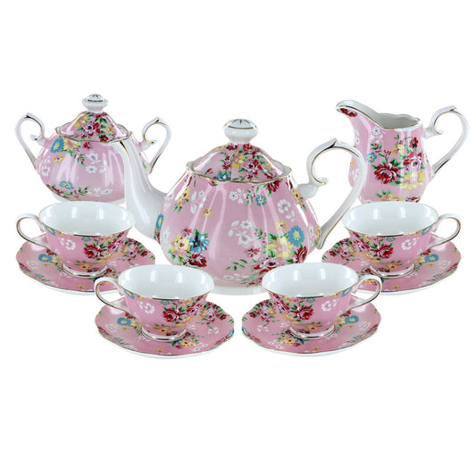 Shabby Rose Pink porcelain floral tea set with teapot, cups, and saucers on a white background