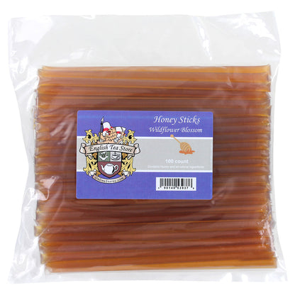 Packaged honey sticks with a visible label on a white background