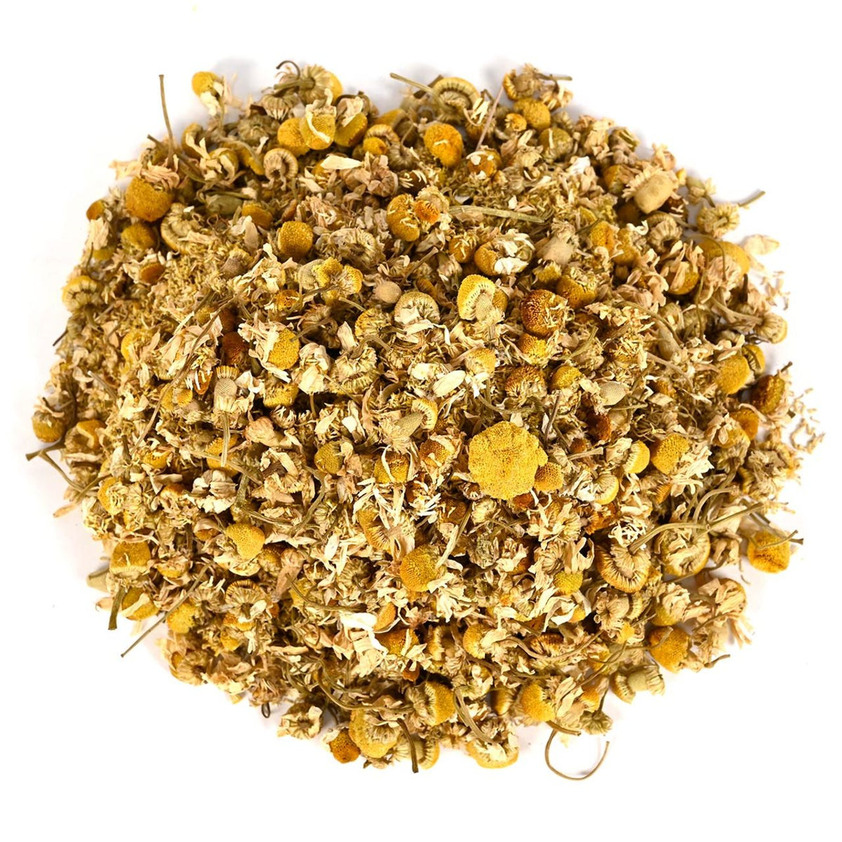 Pile of dried chamomile flowers and tea leaves on a white background
