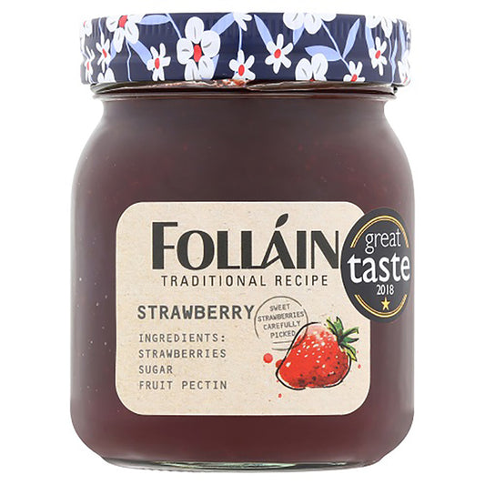 Jar of Folláin strawberry jam with a floral lid on a white background