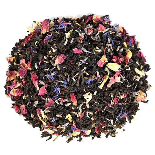 Heap of loose-leaf black tea with mixed with Green Tea, Jasmine Petals, Lavender Petals, and rose petals.