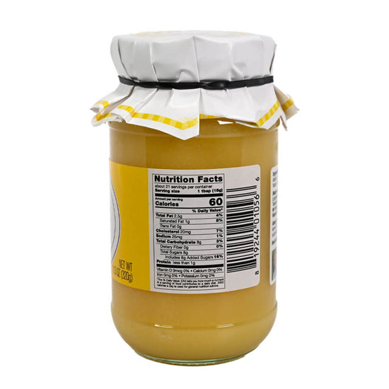 Side view of a jar of Mrs Darlington's Legendary Lemon Curd displaying the nutrition facts label. 