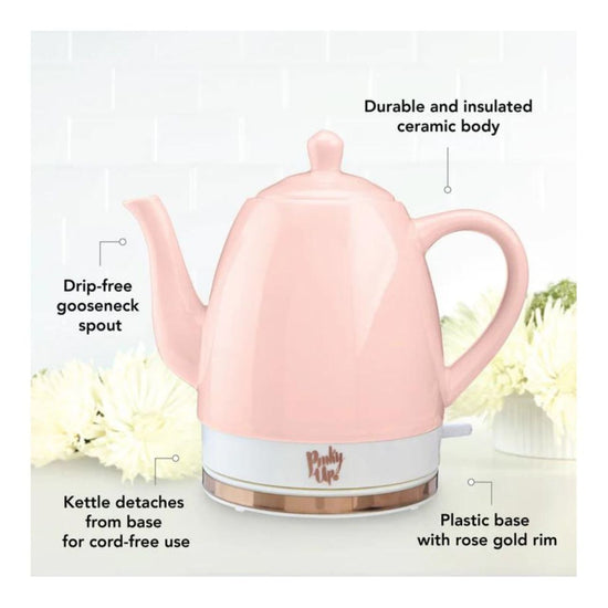 Pink electric kettle with text highlighting features on a white background