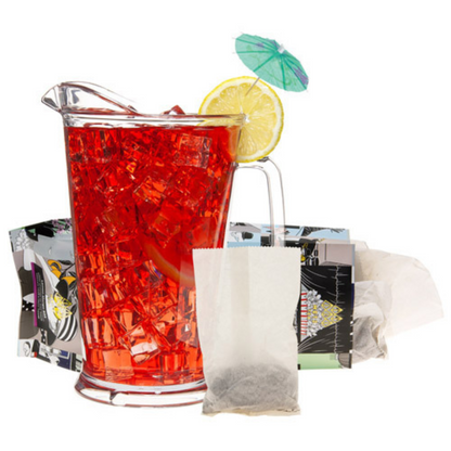 Pitcher of red iced tea with lemon and umbrella, surrounded by tea bags and decorative items on a white background.