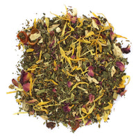A mixture of dried herbs and flowers, including peppermint leaves, rosehip pieces, spearmint leaves, ginger, rooibos, hibiscus, rose, calendula, and osmanthus petals, arranged on a white background.