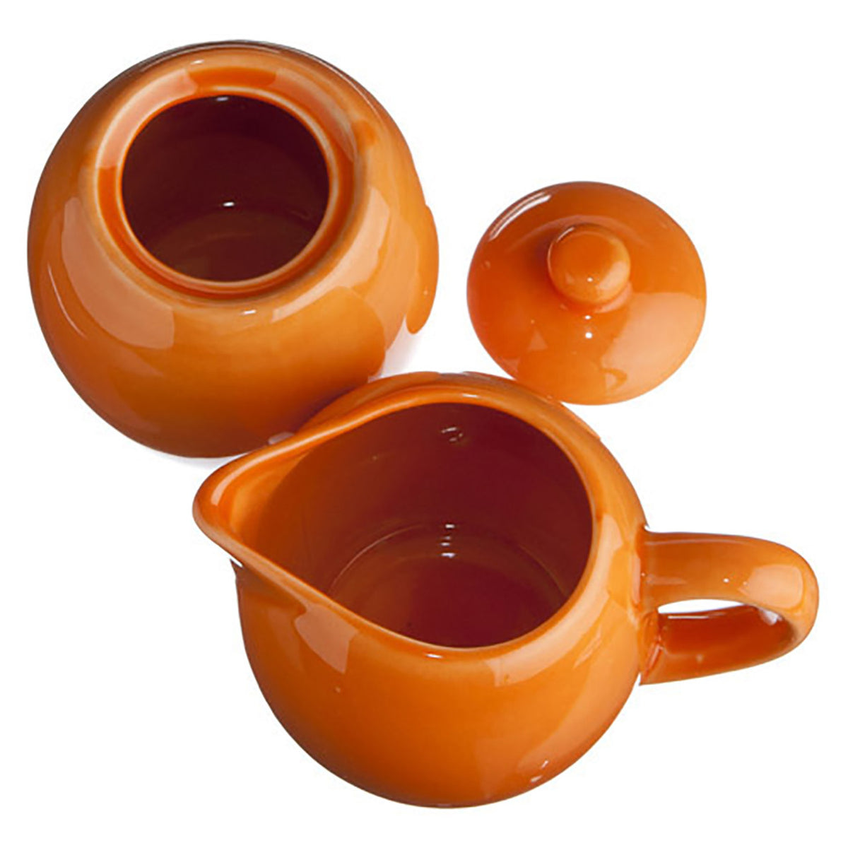Orange ceramic creamer and sugar bowl set on a white background