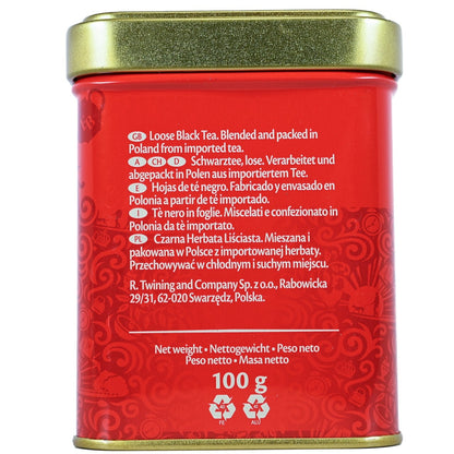Twinings English Breakfast red tea canister with gold lid and text on a white background