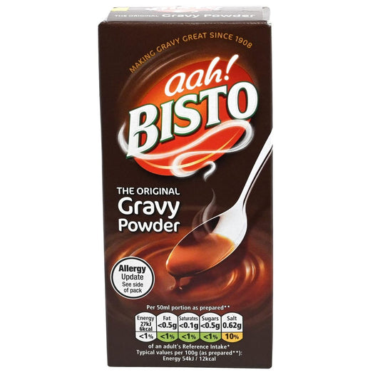 Box of Bisto gravy powder with a spoon and gravy on a white background