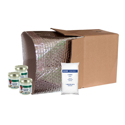 Cardboard box with bubble wrap and a ULINE cold pack on a white background with three jars of clotted cream on side
