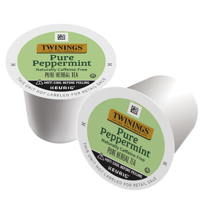 Two Twinings Pure Peppermint tea capsules on a white background