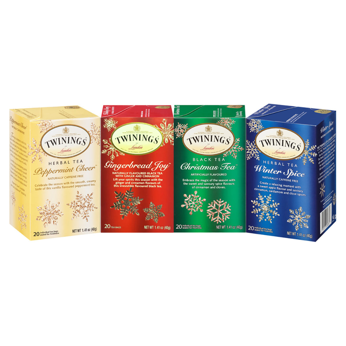 Four Twinings tea boxes with different holiday seasonal flavors on a white background