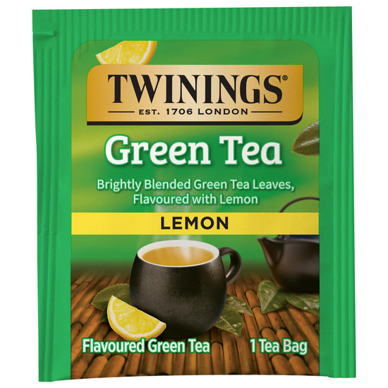 Twinings Lemon Green Tea package with a cup and lemon wedge illustration.  Package is on a white background.