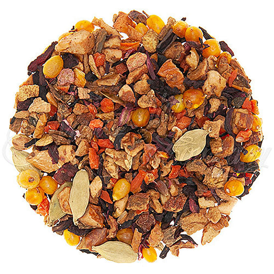 Assorted autumn colored dried tea leaves and fruit pieces on a white background