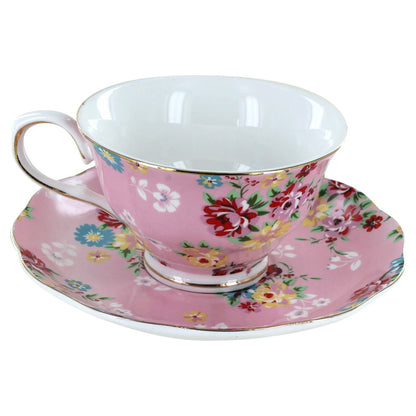 Pink floral teacup and saucer set on a white background