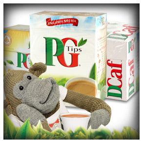 Three boxes of PG Tips tea with a stuff animal monkey