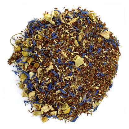 A mixture of dried tea leaves, apple pieces, and other herbal ingredients, loose leaf tea blend.