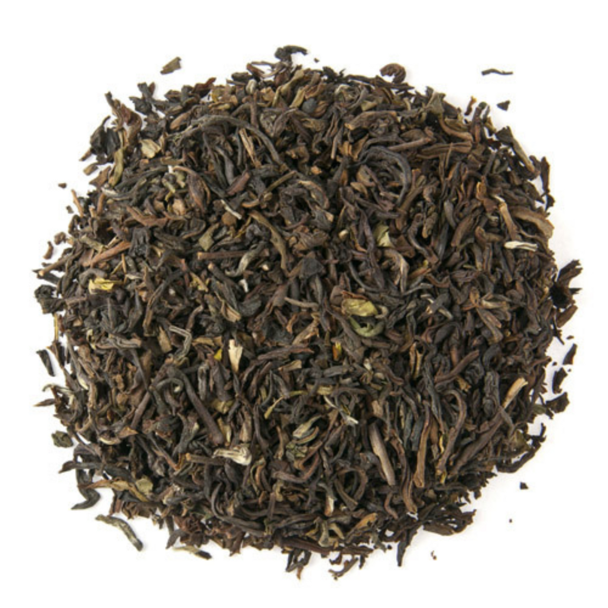 Close-up of dark brown tea leaves on a white background