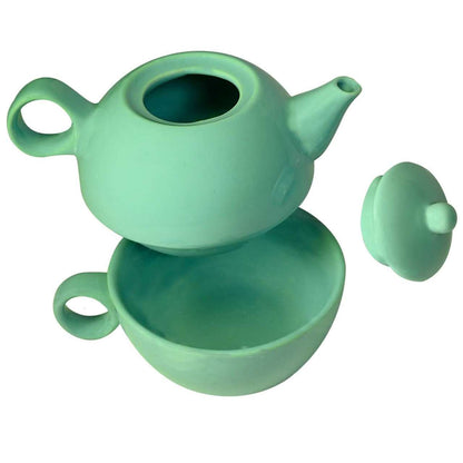 Tea for one ceramic sea foam green teapot and mug combination on a white background