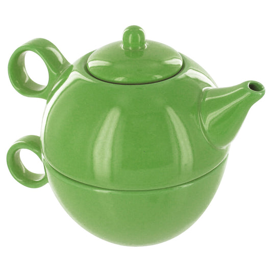 Green ceramic teapot stacked on a matching tea mug on a white background