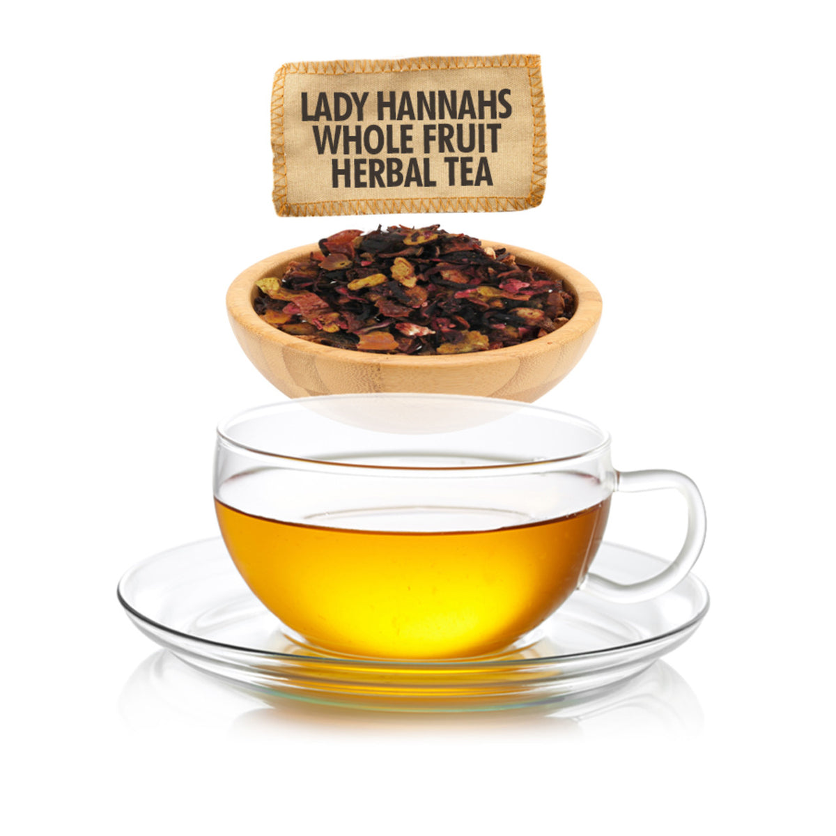 Clear glass cup of tea with a bowl of tea leaves and packaging label on a white background.