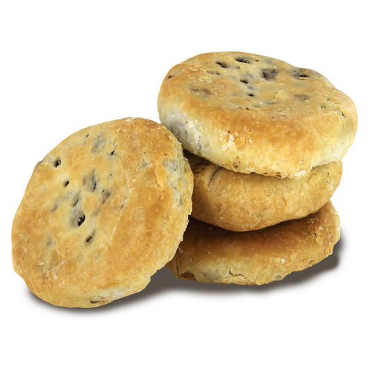 Four Lancashire Eccles Cakes with three stacked on each other and one leaning against the stack all on a white background